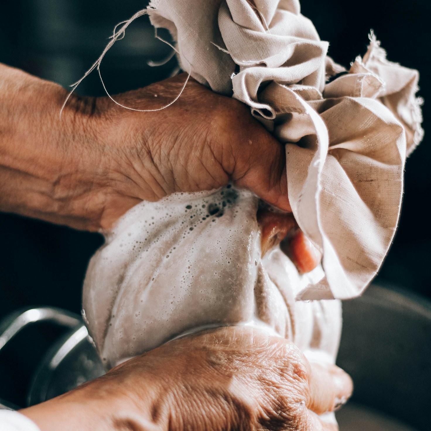 Diverse group of community members sharing a meal together, showcasing the social bonds formed through collaborative cooking